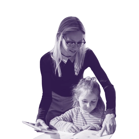 Teacher pointing out details of a book to a child