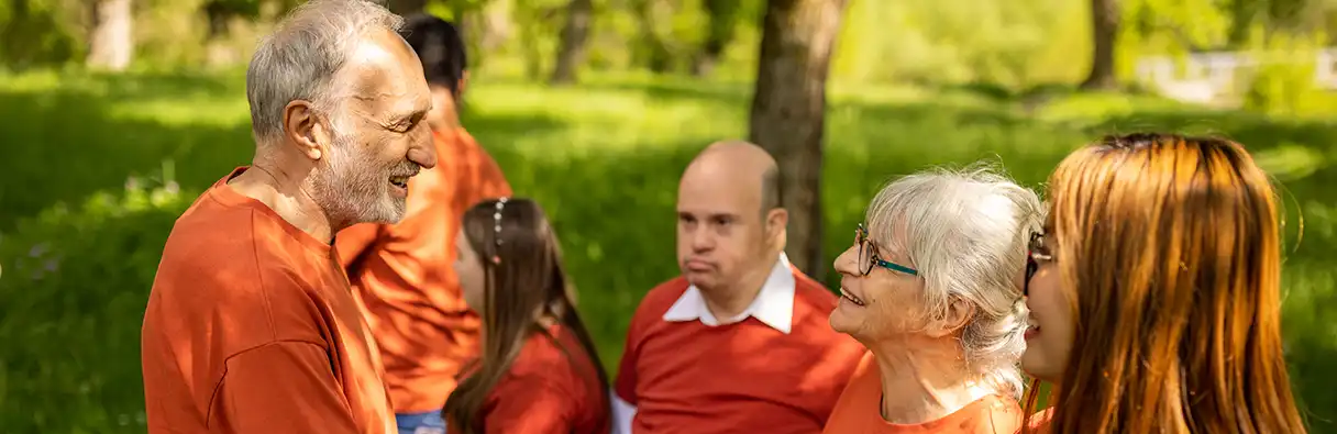 Carer with people in the park